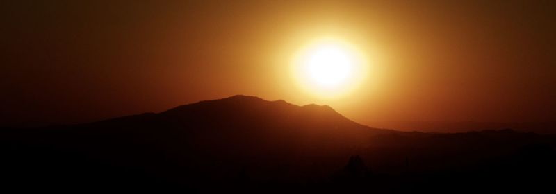 Scenic view of mountains at sunset