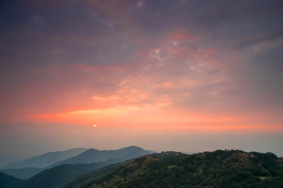Scenic view of mountains against sky during sunset