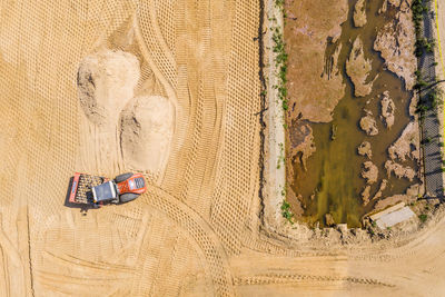 High angle view of footprints on sand