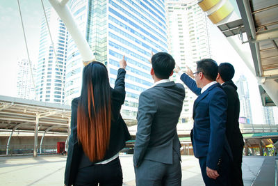 Group of people in front of buildings