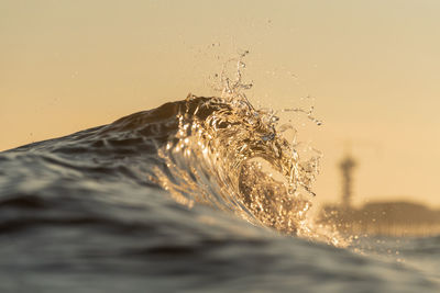 Close-up of water splashing against white background