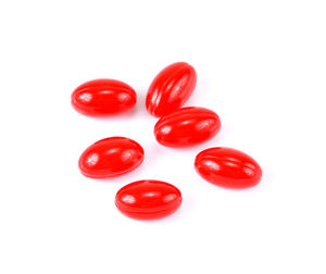 Close-up of red tomatoes against white background