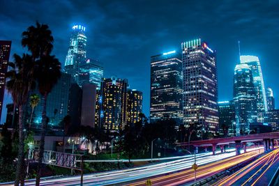 Light trails on road in city at night