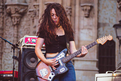 Young woman playing guitar