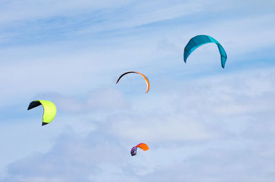 Low angle view of kite flying against sky