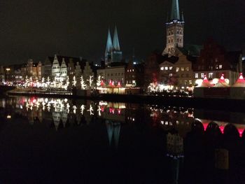 Reflection of buildings in city at night