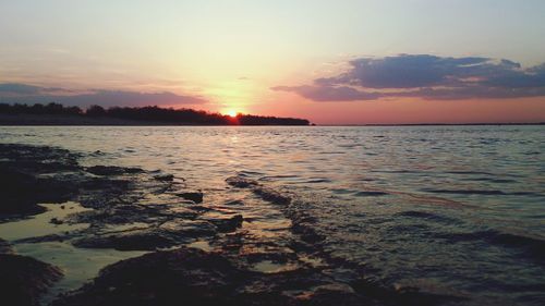 Scenic view of sea at sunset