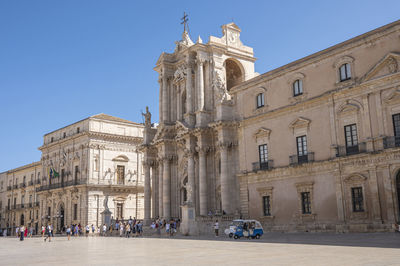 Historic buildings with beautiful facades in piazza duomo in ortigia