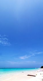 Scenic view of sea against blue sky