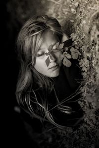 Girl sleeping on grassy land