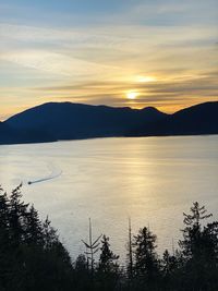 Scenic view of lake against romantic sky at sunset