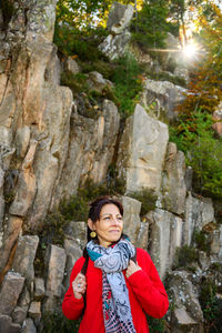 Portrait of a smiling young woman in forest