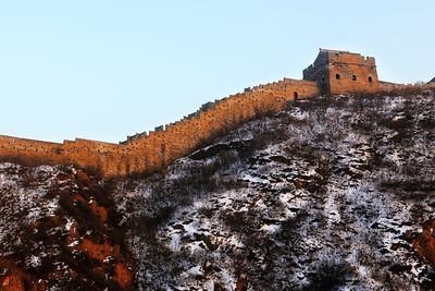 Low angle view of fort against clear sky