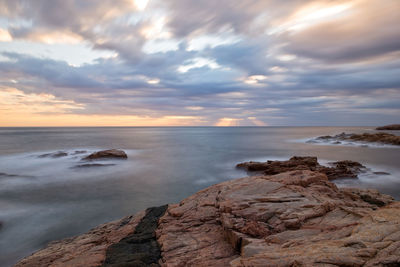 Scenic view of sea against sky at sunset