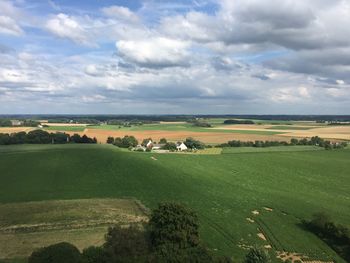 Scenic view of landscape against cloudy sky