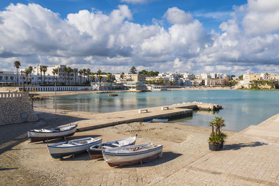 Boats moored at harbor