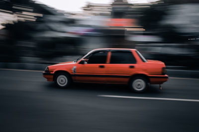 Blurred motion of car on city street