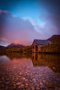 Scenic view of lake against sky during sunset