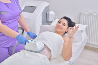 High angle view of woman receiving spa treatment at health spa