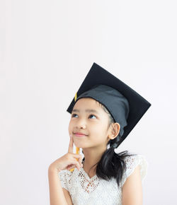 Portrait of a smiling young woman over white background