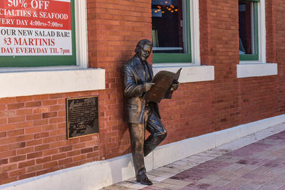 Roland manteiga statue on centro espanol building background in 7th ave.