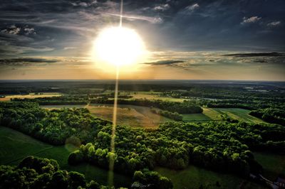 Scenic view of field against sky during sunset