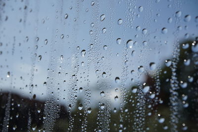 Close-up of raindrops on glass window