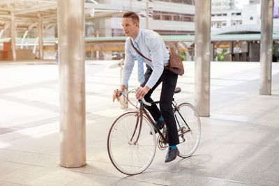 Man riding bicycle in city