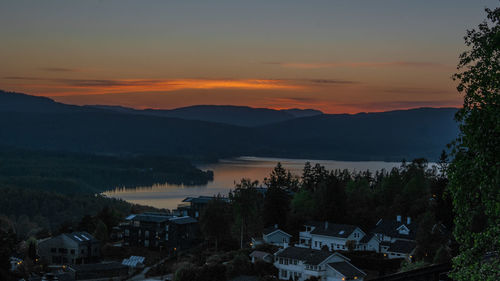 High angle view of houses at sunset