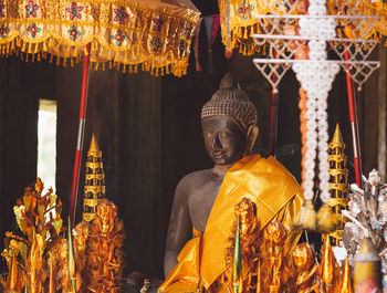 Close-up of buddha statue at temple