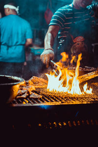 People on barbecue grill