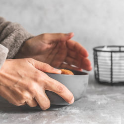 Close-up of man preparing food on table