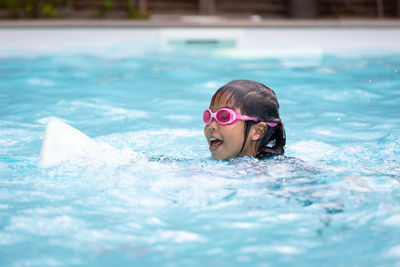 Girl swimming in pool