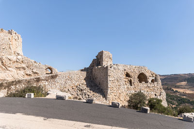 Ruins of building against blue sky