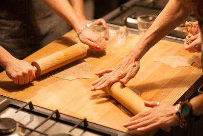 Cropped hands of women preparing food