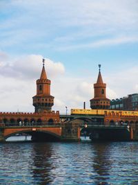 Bridge over river with buildings in background