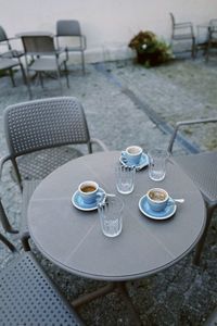 Empty chairs and tables in restaurant