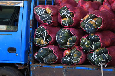 Pumpkins in sacks on truck