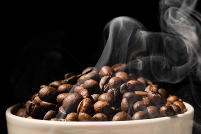 Close-up of coffee beans against black background