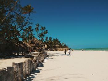 Scenic view of beach against clear sky