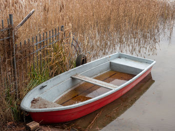 Boat moored by lake