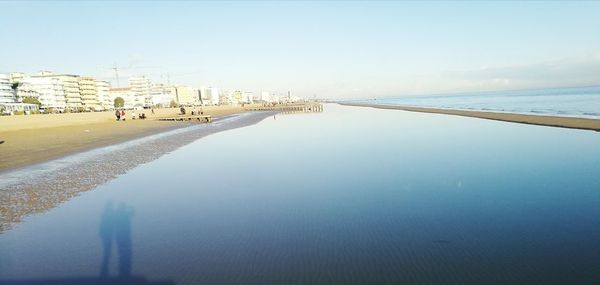 Scenic view of beach against clear sky