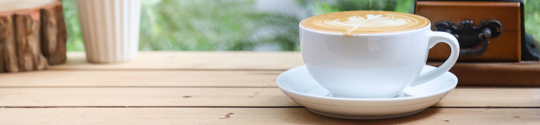 Close-up of coffee cup on table