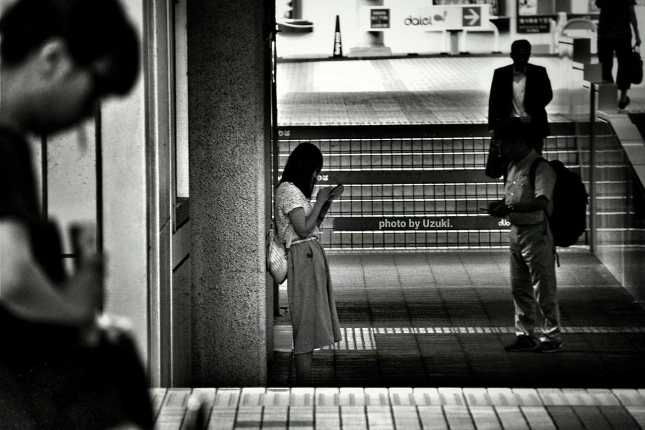 WOMAN WALKING IN CITY