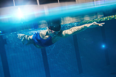 Woman swimming in pool