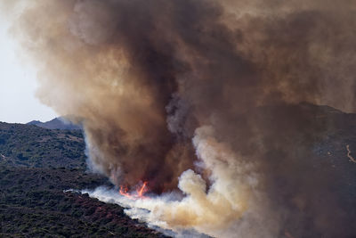 Smoke emitting from volcanic mountain