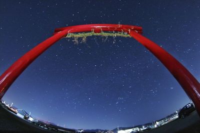 Low angle view of star field against clear blue sky