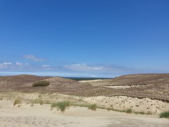 Scenic view of desert against sky