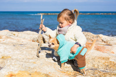 Full length of a boy holding a beach