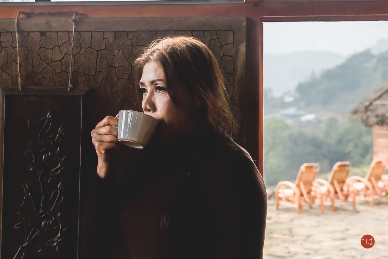 YOUNG WOMAN DRINKING GLASS WITH WATER